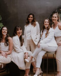 Trunk Events wedding planning team posing together in a professional setting.